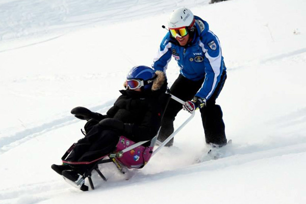Montagna con disabili Folgaria-snow board